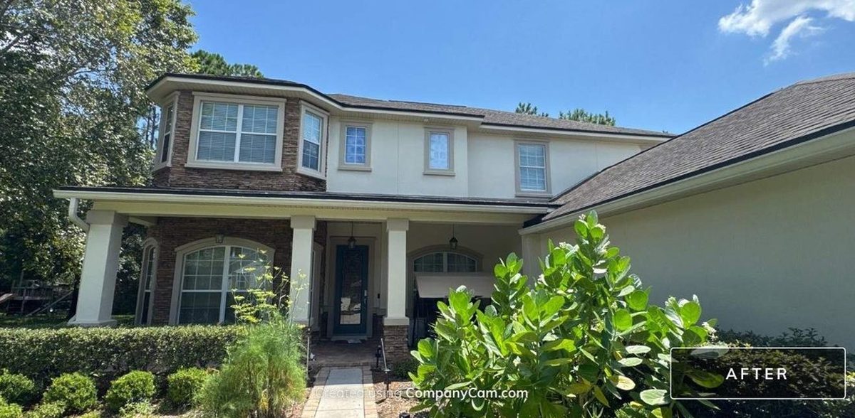 The same two-story stucco home in Jacksonville, FL 32257 after the exterior repaint