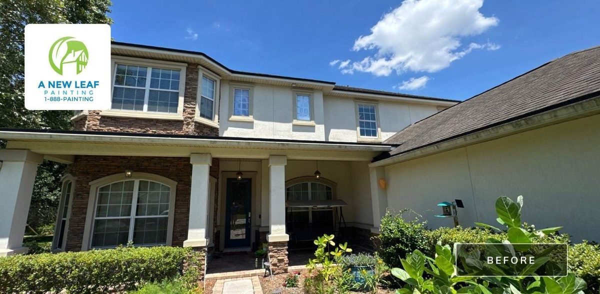 A large two-story stucco home in Jacksonville, FL 32257 before its exterior repaint, weathered across the front elevation