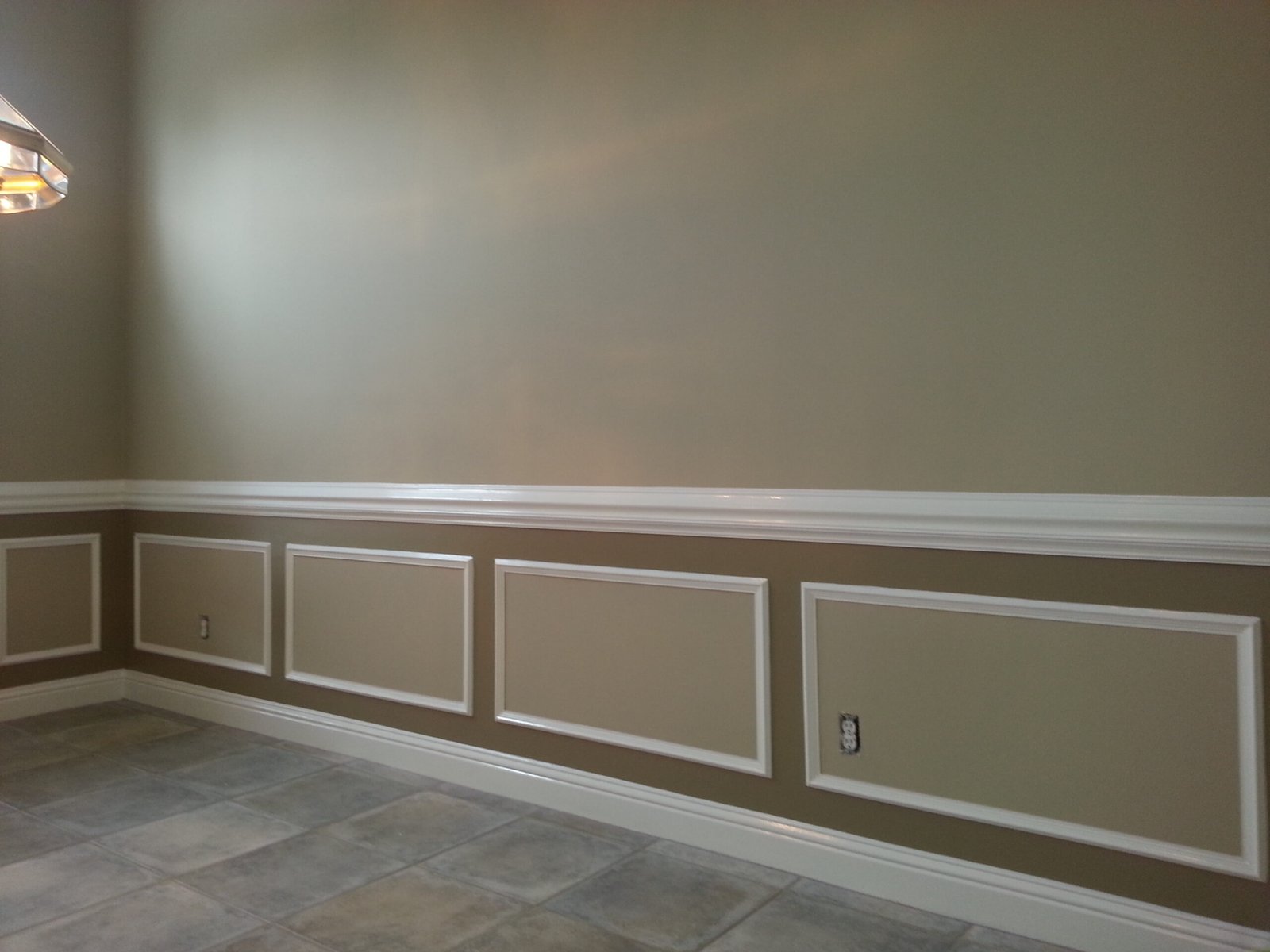 Dining room walls painted above white wainscoting