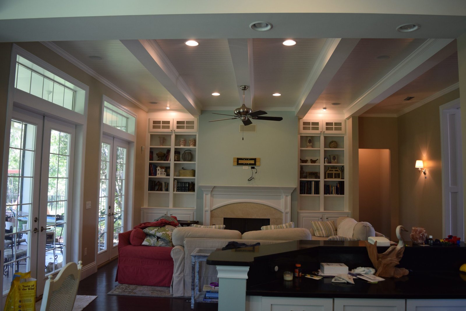 Family room with painted beadboard ceiling and white built-ins