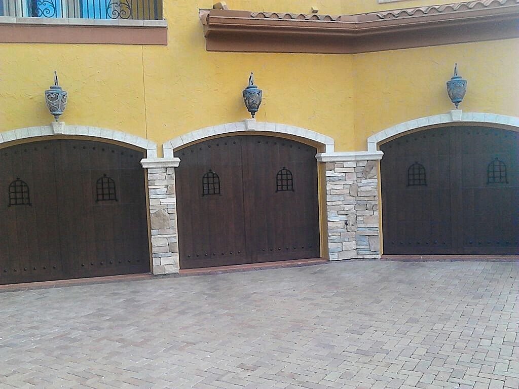 Faux wood finish painted on three garage doors