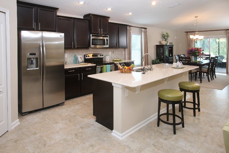 Kitchen with dark stained cabinets