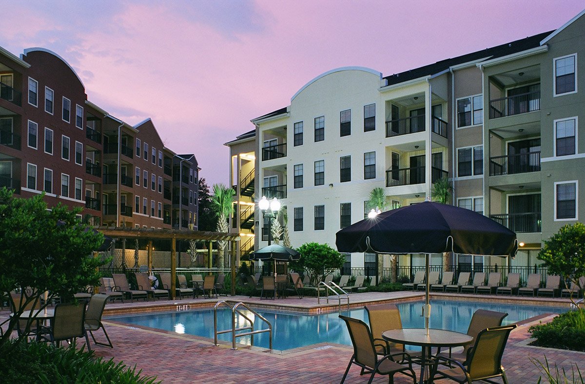 Apartment buildings with pool after exterior painting