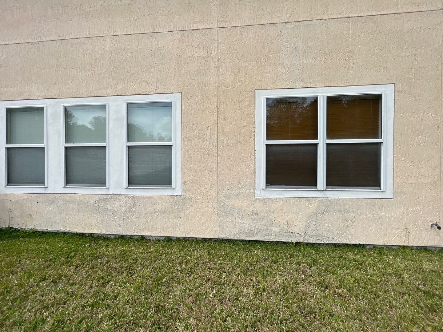 Bulging and delaminated stucco on a Northeast Florida home